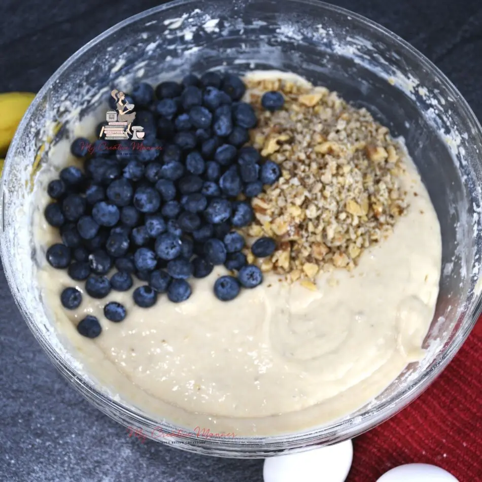 Blueberries in a muffin batter.