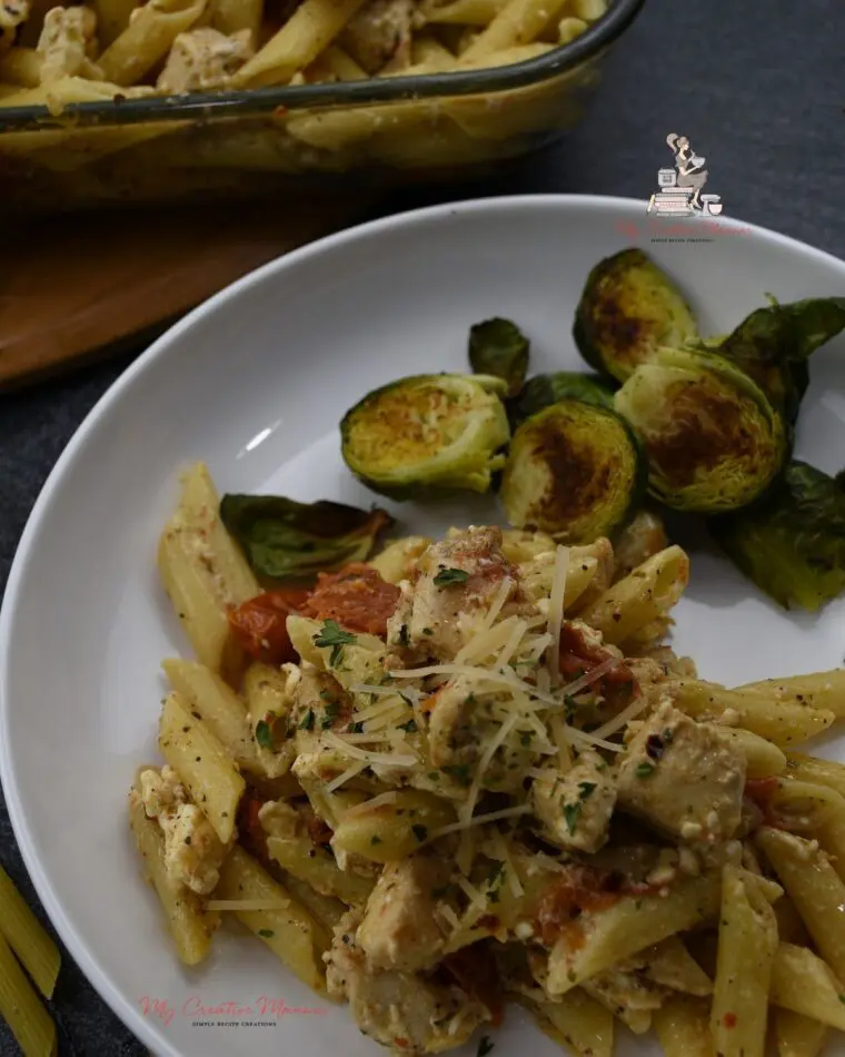 Feta pasts on a plate with Brussel sprouts.
