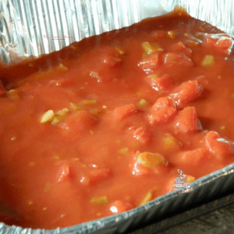 Enchilada Sauce in a foil pan.