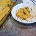 Apple dump cake on a white plate.