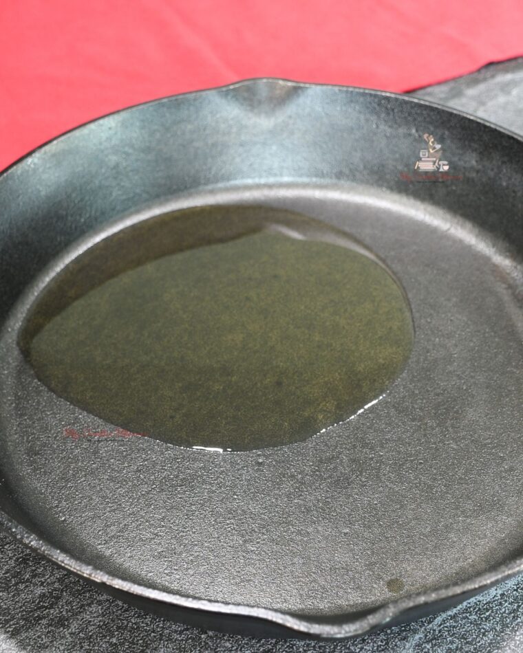 Olive oil in a cast iron pan.
