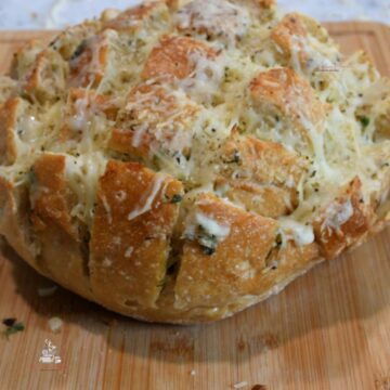 A close up of the finished pull apart cheese bread.