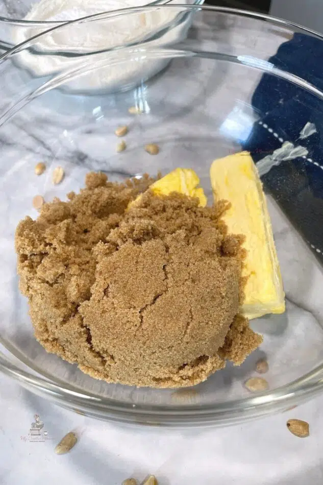 Brown sugar and butter in a glass bowl.