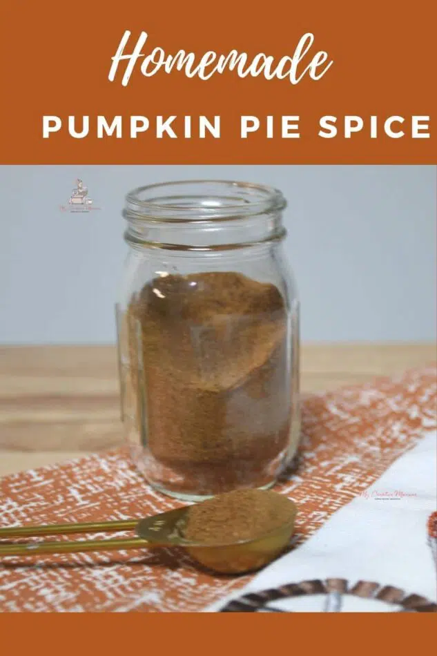 A mini mason jar with the homemade spice in it. Along with a measuring spoon that has some in it.