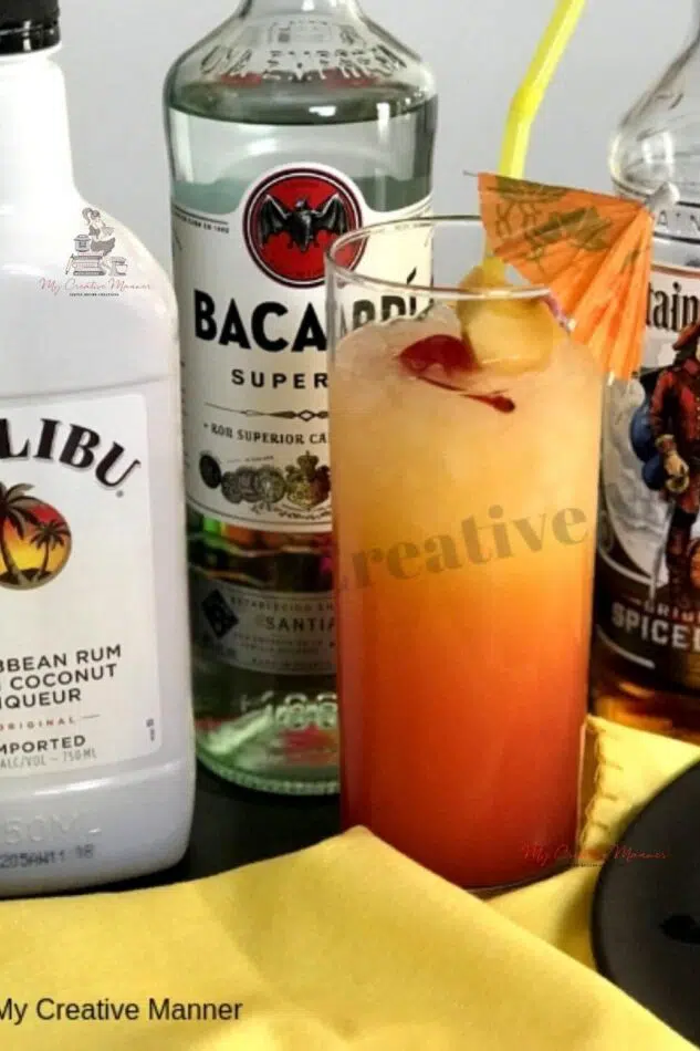 An Bahama Mama cocktail that is made with pineapple and orange juice, along with three types of rums.
