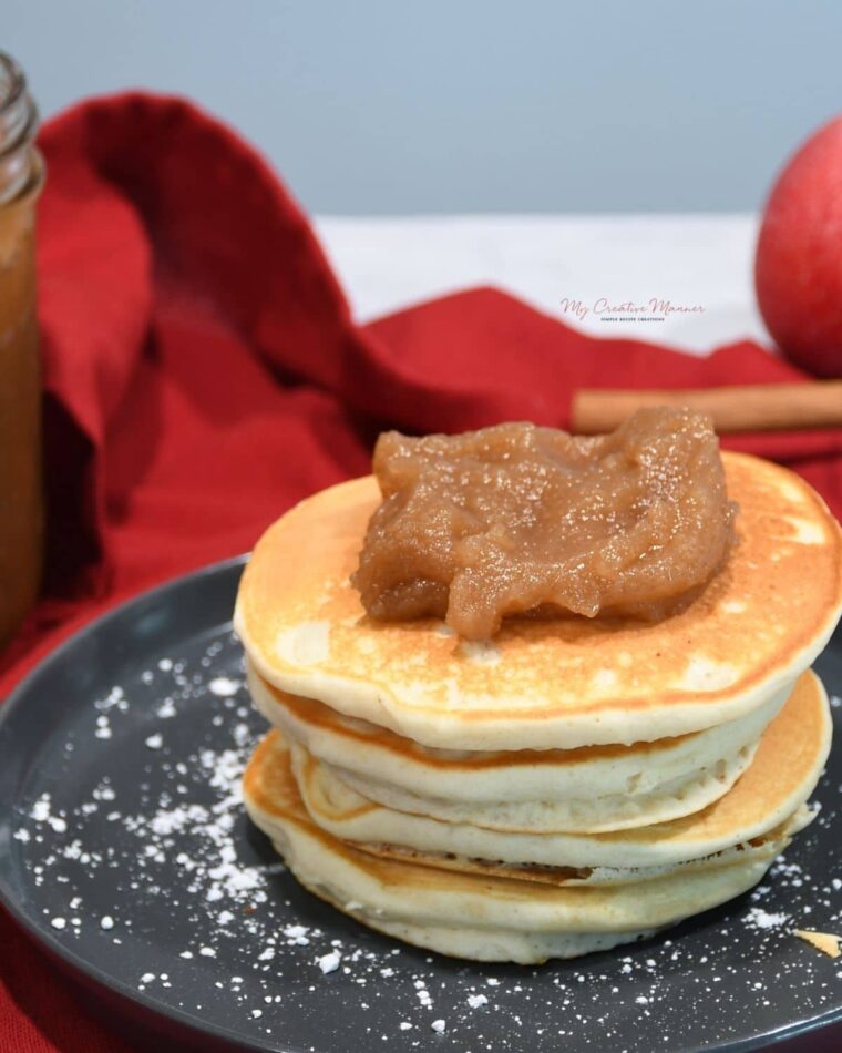 Apple pear sauce on top of pancakes.