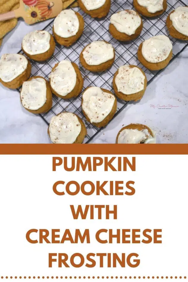A cooling rack that has pumpkin spiced cookies with cream cheese frosting on it.