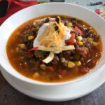 A bowl filled taco soup with corn that was made in the Instant Pot.
