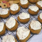 A top view of cookies on a cooling rack.