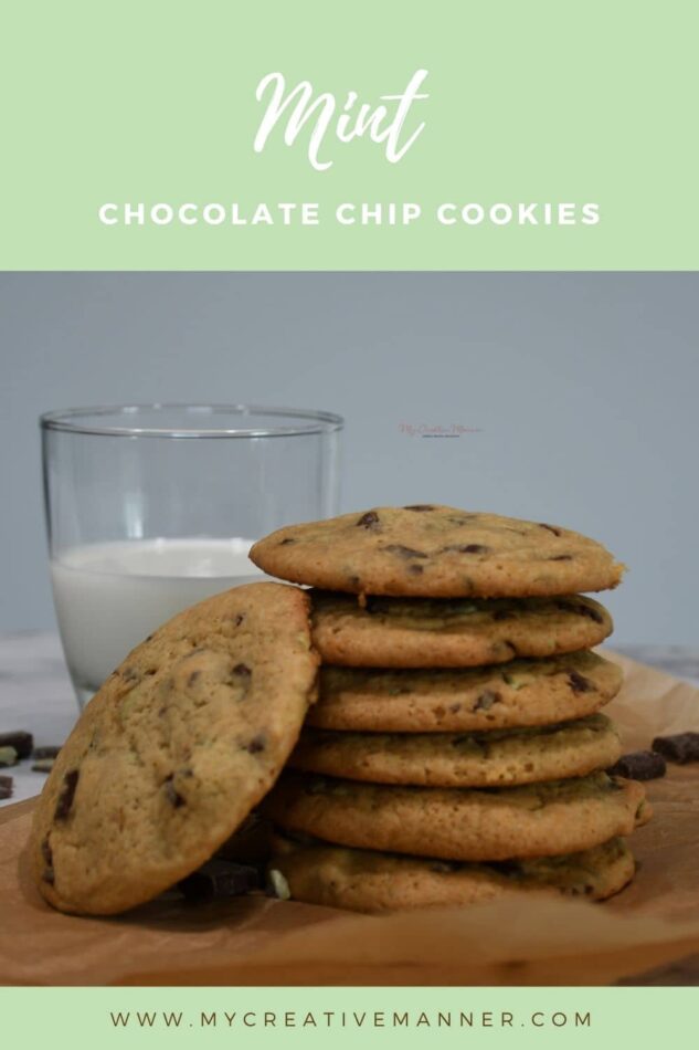 A stack of cookies with a glass of milk.