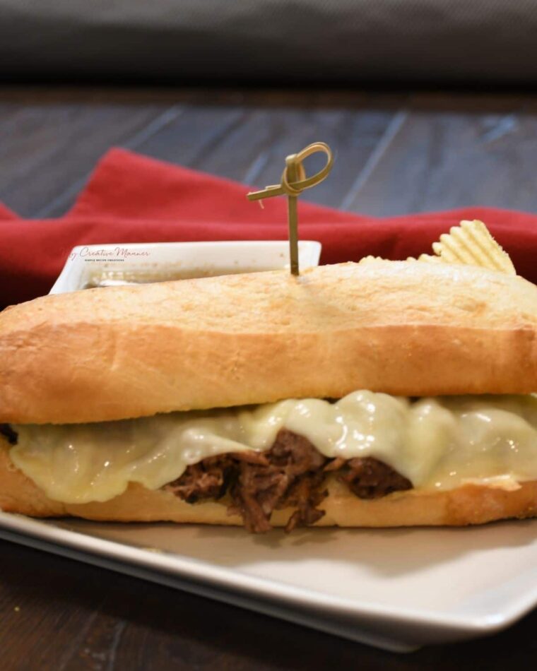 Instant Pot French dip sandwich on a platter.