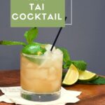 A glass that is filled with the cocktail recipe for a mai tai.