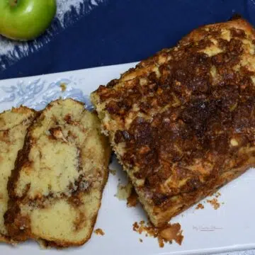 A loaf of apple cinnamon bread that has been sliced.
