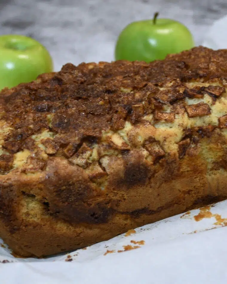 A loaf of apple cinnamon bread that hasn't been cut.