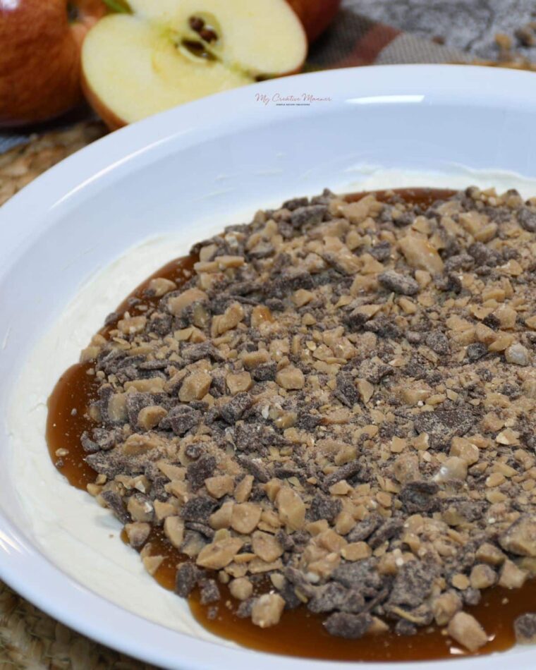 A dish with the caramel apple cream cheese dip in it.