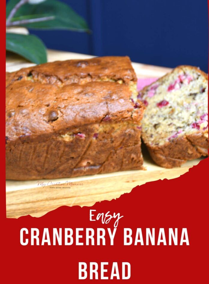 A loaf of cranberry banana bread that has been sliced on a cutting board.