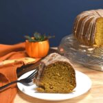 A slice of cinnamon glazed pumpkin bundt cake on a plate.