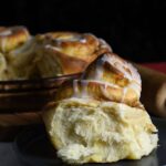 Close up of pumpkin butter cinnamon roll on a plate.