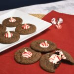 Chocolate peppermint kiss cookies on a white plate.