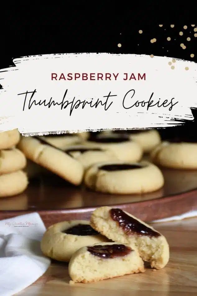 The words raspberry jam thumbprint cookies over two cookies on is broke in half.