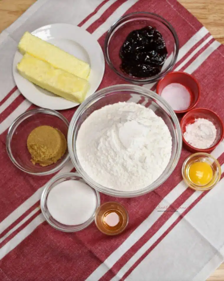 All the ingredients to make raspberry jam thumbprint cookies from scratch.