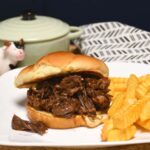 Instant Pot bbq sandwiche on a plate with French fries.