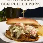 Pork on a bun that is topped with cheese and coleslaw, the words easy 2 ingredient slow cooker bbq pulled pork are at the top of the image.