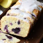 A close up of a slice of lemon and blueberry quick bread recipe.