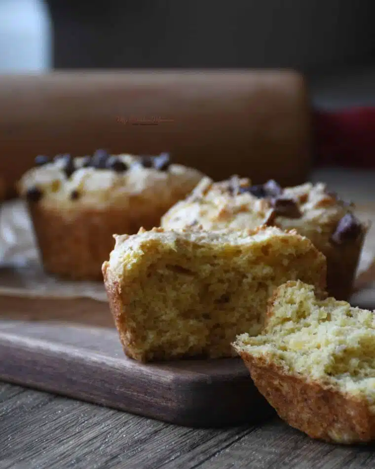 Close up of two ingredient banana muffins on a cutting board.