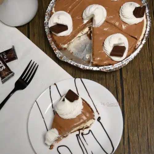 Overhead image of the full pie and a plate that has a slice of the chocolate pie on it.