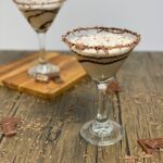 Two martini glasses that are filled with the chocolate cocktail recipe.
