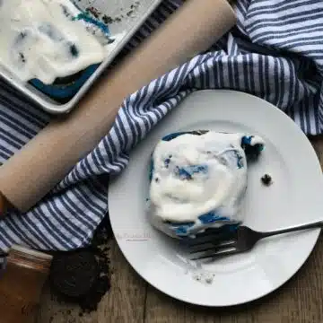 Overhead image of a Cookie Monster cinnamon roll on a plate.