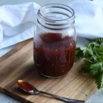 A mason jar that is filled with this easy recipe for 2-ingredient bbq sauce.