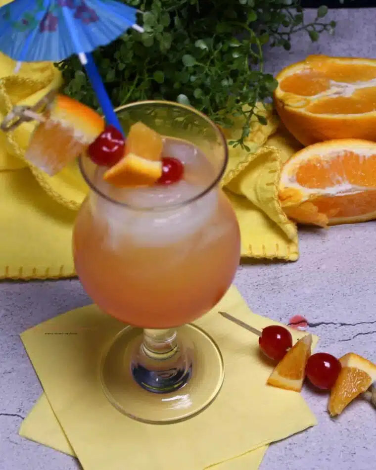 Overhead image of the hurricane glass that is filled with the drink recipe.