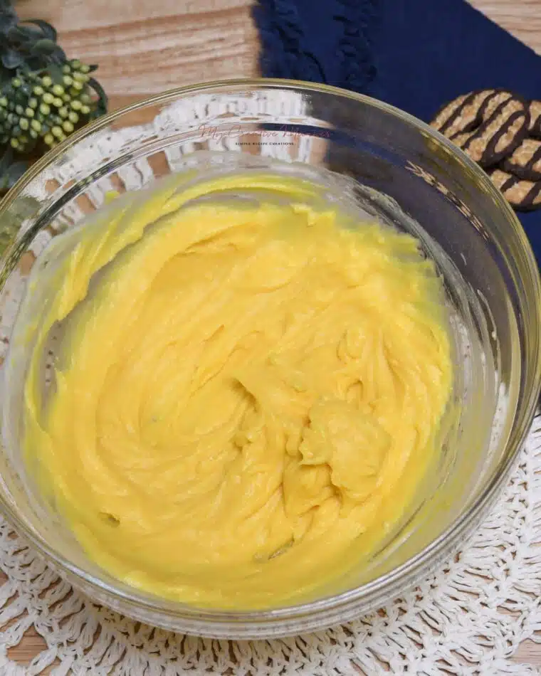 Overhead image of vanilla instant pudding mixed together with buttermilk for the cookie salad recipe.