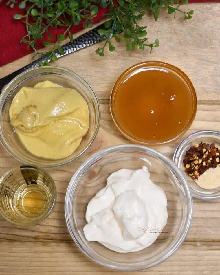 Overhead image of all the ingredients that it takes to make spicy honey mustard sauce recipe.