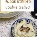 The words fudge stripe cookie salad are at the top of the image with a small bowl that is filled with the cool whip salad.