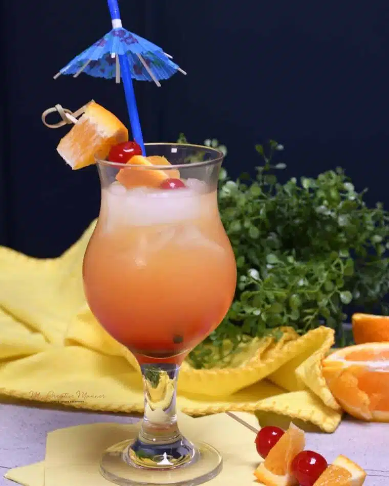 A cocktail glass filled with Malibu sunset drink recipe.