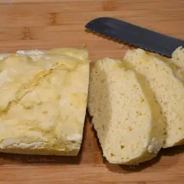 Looking down on a loaf of 2 ingredient bread that has been sliced.