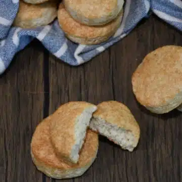 Golden brown pancake mix biscuits stacked ona. counter.