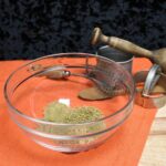 Front view of a mixing bowl with the homemade Italian spice blend in it.