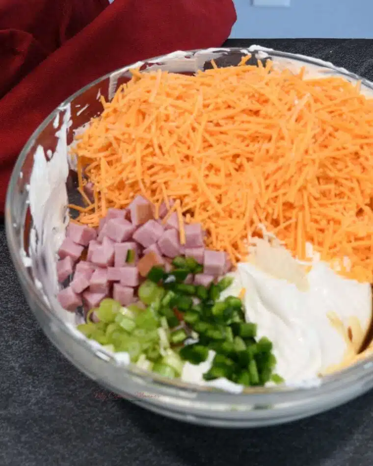 A large bow filled with the creamy ingredients to make this sinful dip recipe.