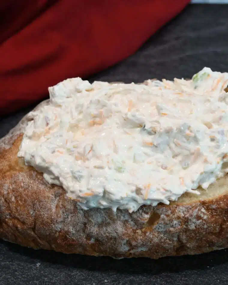 A bread bowl filled with unbaked Mississippi sin dip in it.