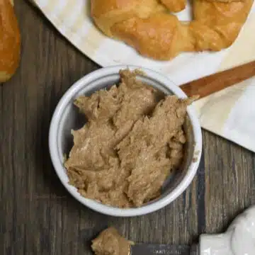 Looking down in to a small bowl that has the cinnamon brown sugar butter spread in it.