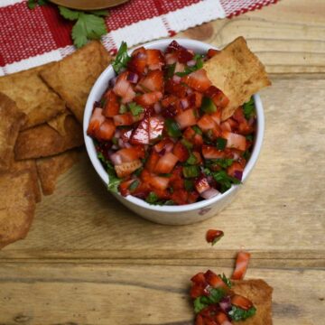 Looking down on a bowl of fresh strawberry salsa.