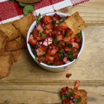 Looking down on a bowl of fresh strawberry salsa.